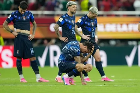 Uruguay players slump after defeat to Spain