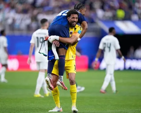 Vozinha celebrates with Livramento after Cape Verde qualify for the knockout stages, where they will face world champions Argentina.