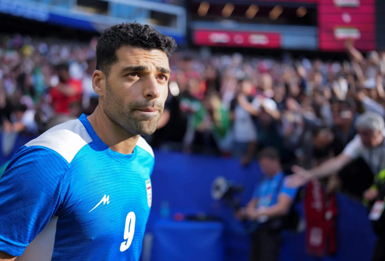 Iran's Mehdi Taremi walks on to the pitch before the group G match against Egypt