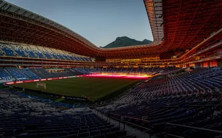 View of Monterrey stadium with a view of a mountain in the background.
