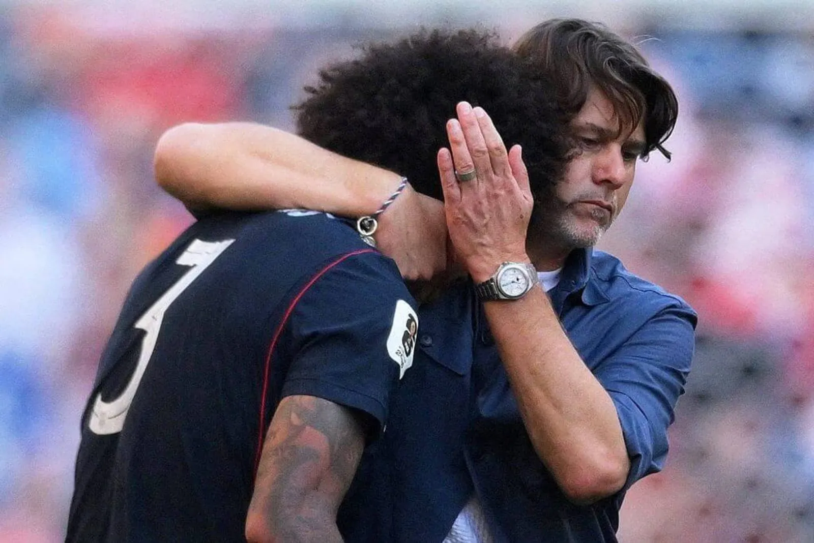 Mauricio Pochettino, right, and Chris Richards react after the USMNT's loss to Belgium.
