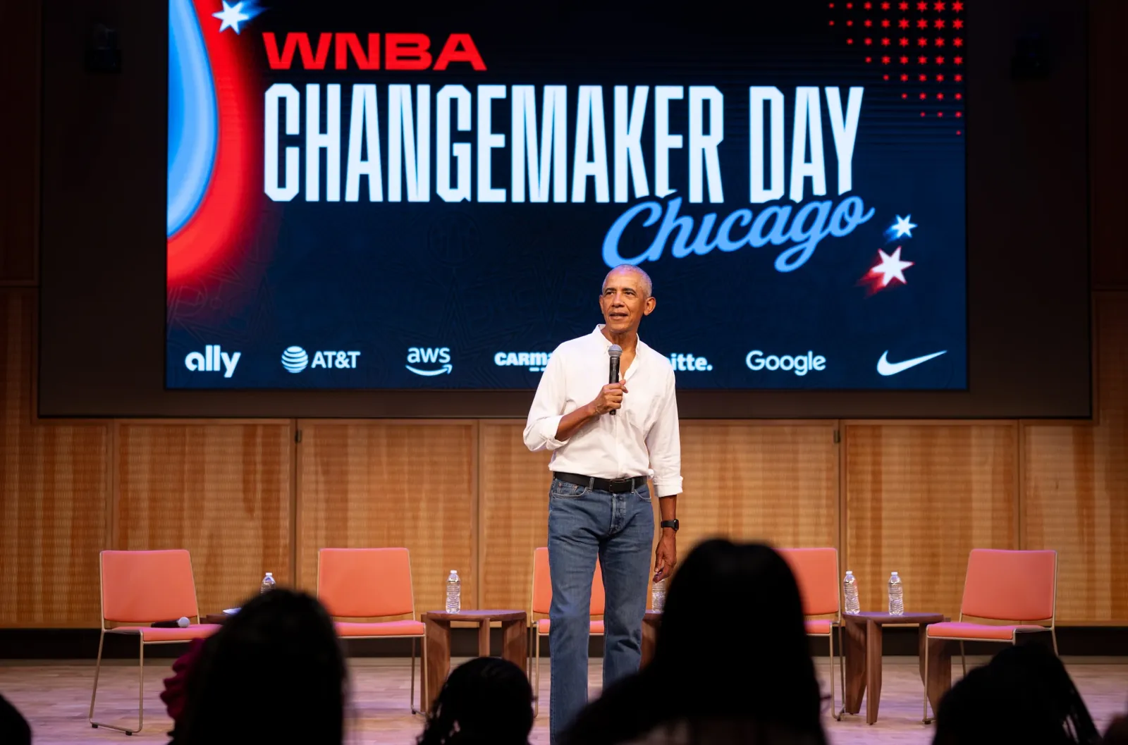 Former President Barak Obama surprises a group of high school freshman girls Friday during the WNBA Changemaker Day at the Obama Presidential Center in Jackson Park on the South Side.
