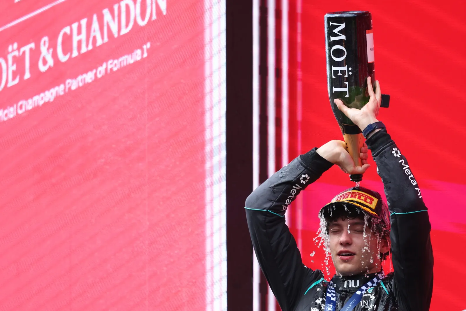 Mercedes driver Andrea Kimi Antonelli of Italy celebrates on the podium after winning the Formula One Grand Prix at the Spa-Francorchamps racetrack in Spa, Belgium, Sunday, July 19, 2026. (AP Photo/Omar Havana)