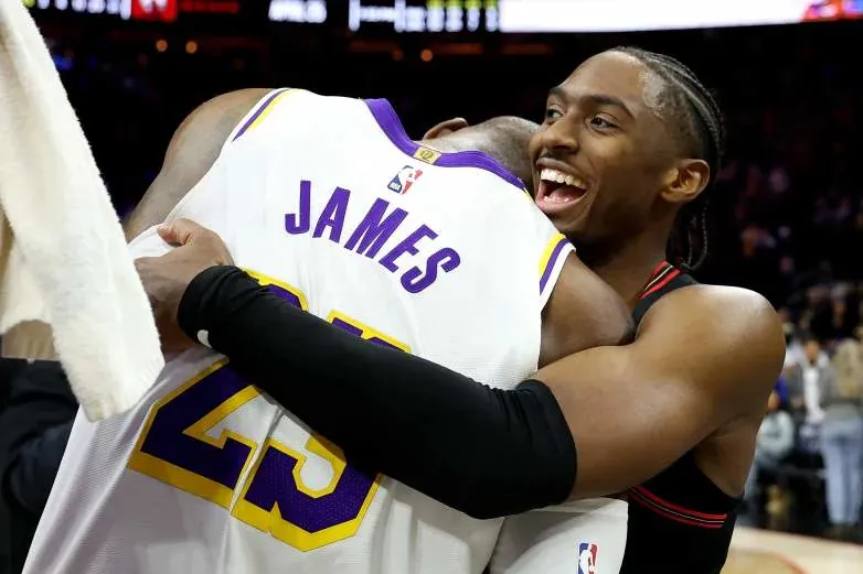 Tyrese Maxey, a Klutch Sports client who has developed a close relationship with LeBron James, embraces the four-time MVP after an NBA game. The 76ers are reportedly among the teams making a pitch to James in free agency following their blockbuster acquisition of Jaylen Brown.