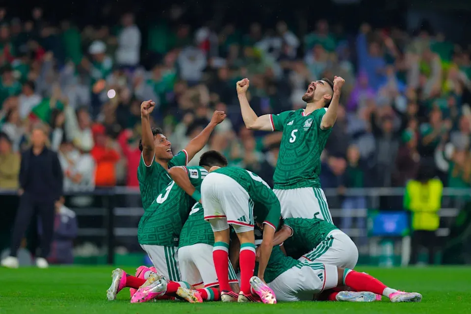 Mexico players celebrate after Raul Jiménez's 31st-minute goal in their 2-0 World Cup win over Ecuador.(Jam Media via Getty Images)