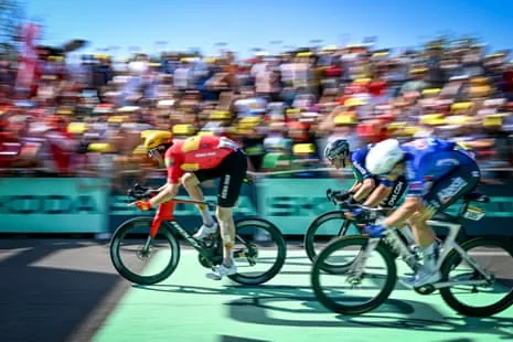 Soren Wærenskjold of Uno-X Mobility shouts in celebration as he sprints towards the finish line to win stage 11..