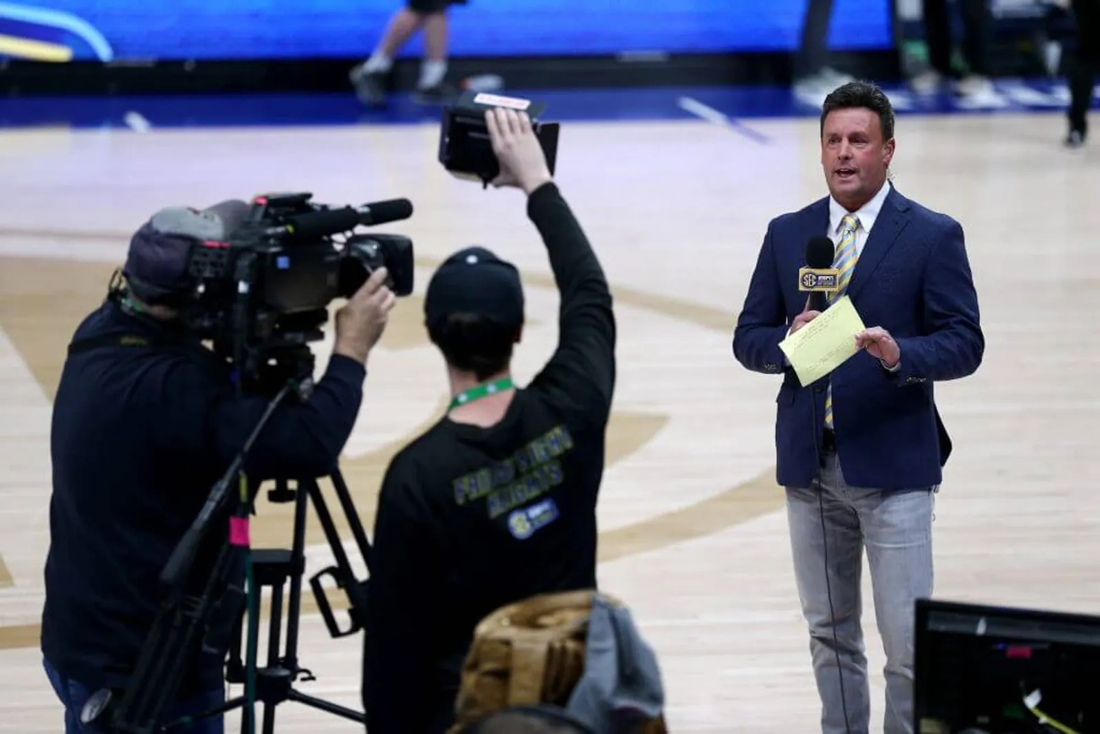 Karl Ravech of ESPN talks on air after the announcement of the cancellation of the SEC Basketball Tournament at Bridgestone Arena on March 12, 2020 in Nashville, Tennessee. The tournament has been cancelled due to the growing concern about the spread of the Coronavirus (COVID-19).